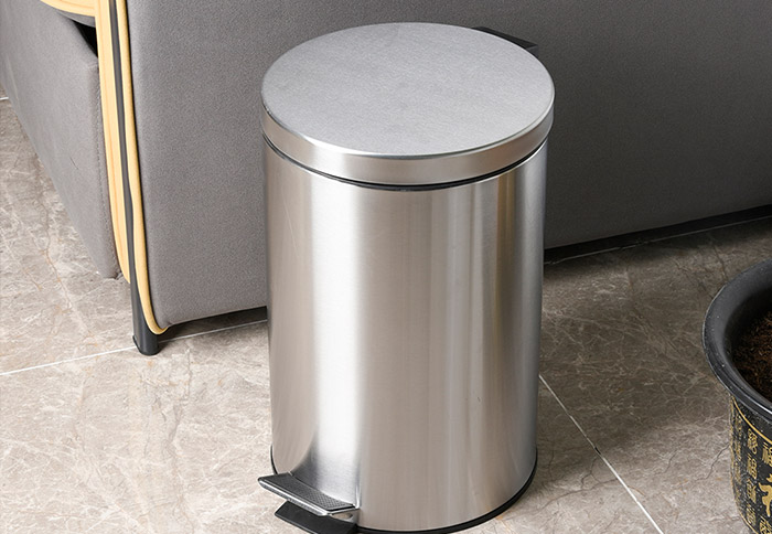 What is the advantage of a pedal trash can?